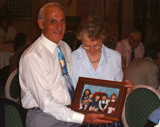 dscf0049.jpg - Nanny and Grandad. With a photo of all their great grandchildren. Which is nice.